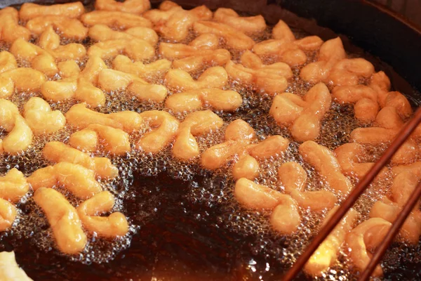 Deep-fried dough stick on the pan — Stock Photo, Image