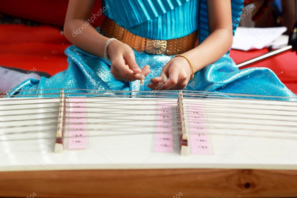 Children playing dulcimer Thailand