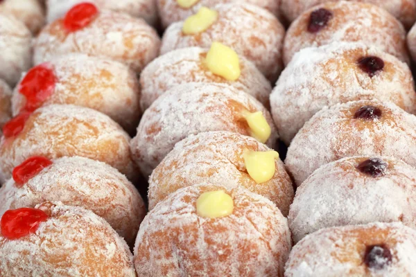 A lot of donut and strawberry jam — Stock Photo, Image