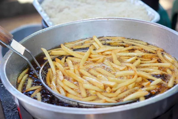 French fries in the pan — Stock Photo, Image