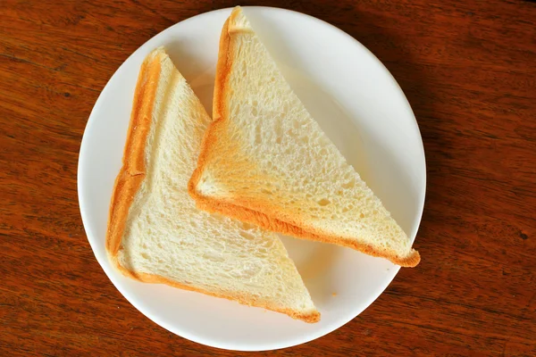 Pane e burro deliziosi in piatto . — Foto Stock