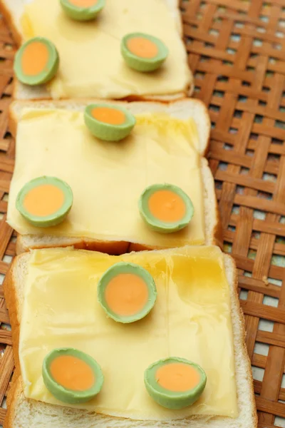 Cheese the place on a slice of bread and chocolate round. — Stock Photo, Image