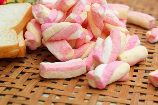 Fresh milk and pink marshmallows with a slice of bread. — Stock Photo, Image