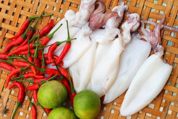 Fresh squid in a basket - for cooking. — Stock Photo, Image