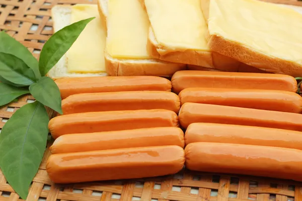 Cheese the place on a slice of bread and sausage. — Stock Photo, Image