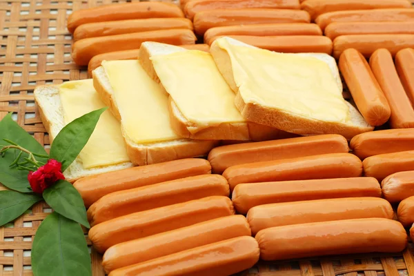 Cheese the place on a slice of bread and sausage. — Stock Photo, Image