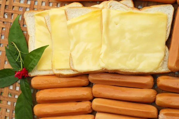 Cheese the place on a slice of bread and sausage. — Stock Photo, Image