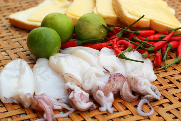 Fresh squid in a basket - for cooking. — Stock Photo, Image