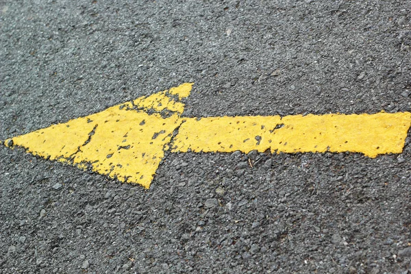 Yellow arrow on the road — Stock Photo, Image