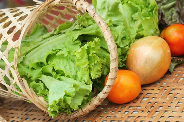 Vegetables salad and tomato in the basket — Stock Photo, Image