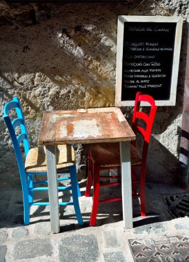 small and characteristic table and menu of the dishes of the day of a restaurant in the alleys of the center May 23 2022 Bolsena Italy