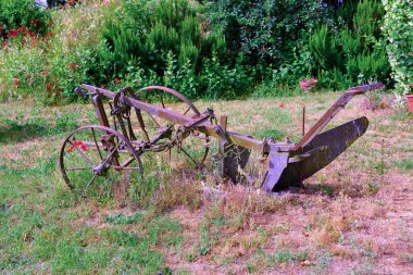 old plow in Peccioli tuscany Italy
