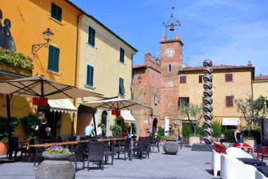 piazza Vittorio veneto the castle and the clock tower June 4 2022 Lajatico Italy