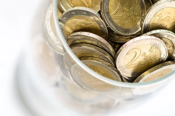 Coins in glass — Stock Photo, Image