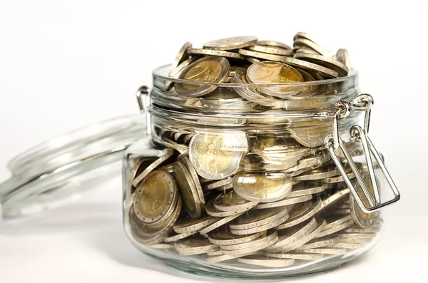 Coins in glass — Stock Photo, Image