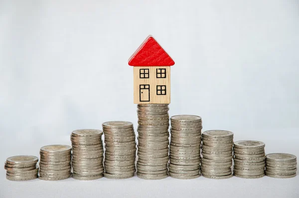 Coins and house — Stock Photo, Image