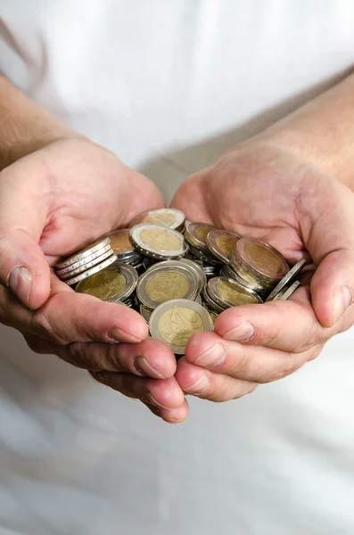 Coins in hands — Stock Photo, Image