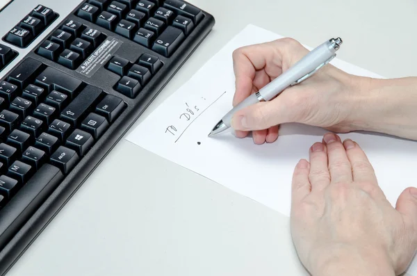 Keyboard and to do list Stock Photo