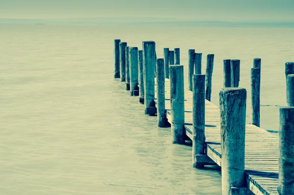 Wooden bridgwe in the water — Stock Photo, Image