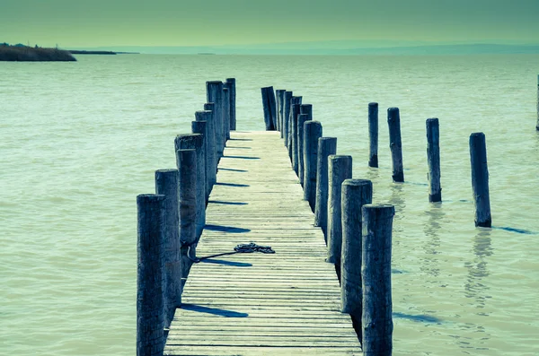 Wooden bridgwe in the water — Stock Photo, Image