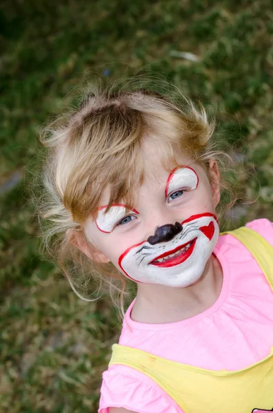 Dziecko z malowanie twarzy — Zdjęcie stockowe
