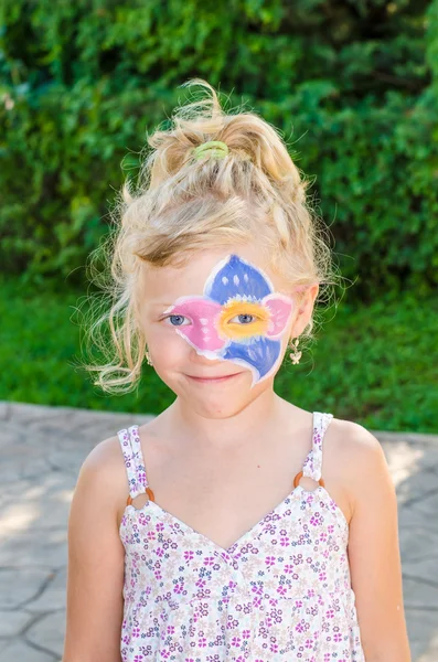 Girl with flower face painting — Stock Photo, Image