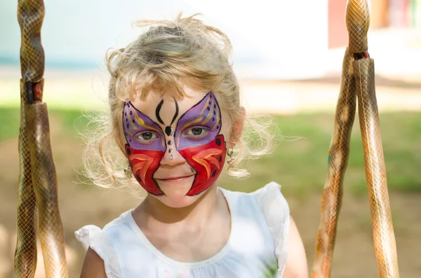 Girl with butterfly face painting Stock Picture