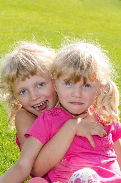 Blond girls on grass — Stock Photo, Image