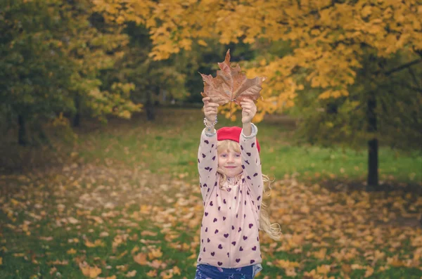 Adorable Blond Girl Colorful Jacket Enjoying Color Autumnal Leaves — Fotografia de Stock