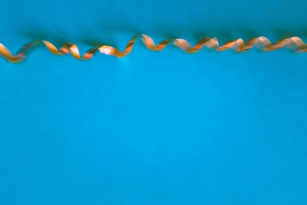 Golden Ribbon Blue Backgrounds Blurred Defocussed Effect — Stock Photo, Image
