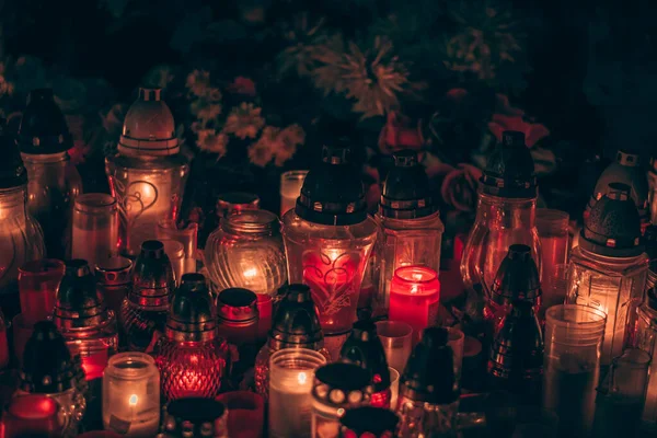 All Saints Day concept with burning candles background