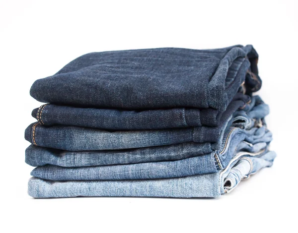 Stack of jeans on white background — Stock Photo, Image