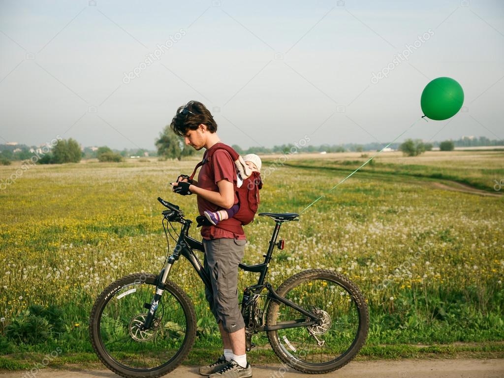 riding bike with baby in ergo