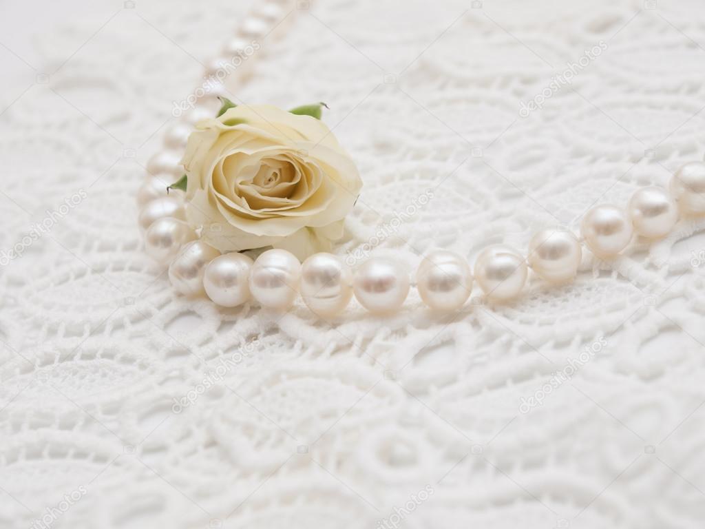 White pearl with white rose on white lace