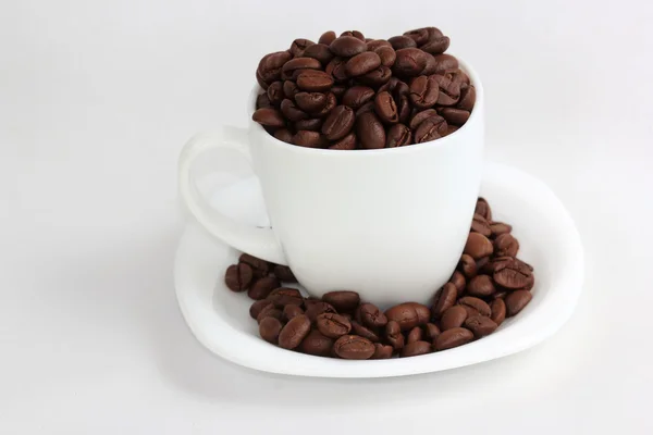 Koffie bean in de cup — Stockfoto