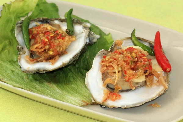 Oyster with spicy sauce — Stock Photo, Image