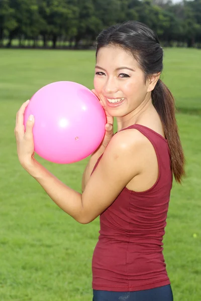 Girl and pink ball — Stock Photo, Image