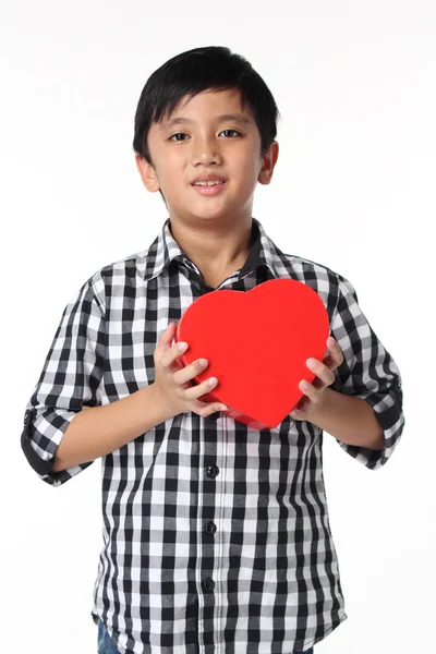 Asian Boy giving red heart-shaped box — Stock Photo, Image