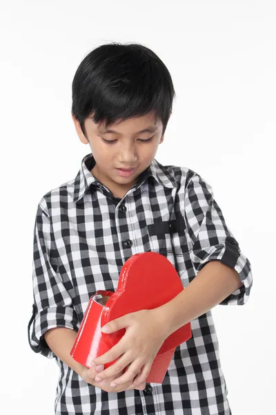 Asian Boy open red heart-shaped box — Stock Photo, Image