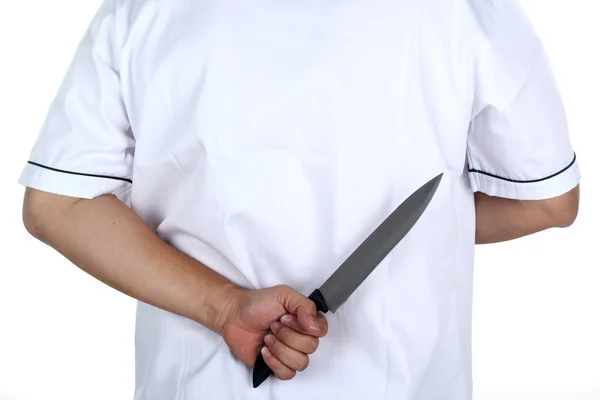 Chef holding a knife behind — Stock Photo, Image