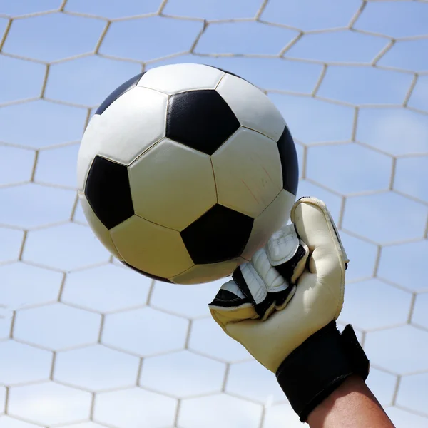 Goalkeeper's hands hitting foot ball — Stock Photo, Image
