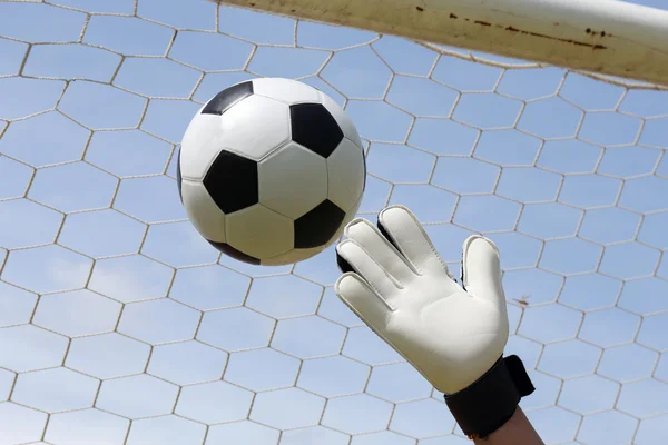 Goalkeeper's hands reaching foot ball — Stock Photo, Image