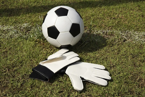 Gloves and soccer ball — Stock Photo, Image