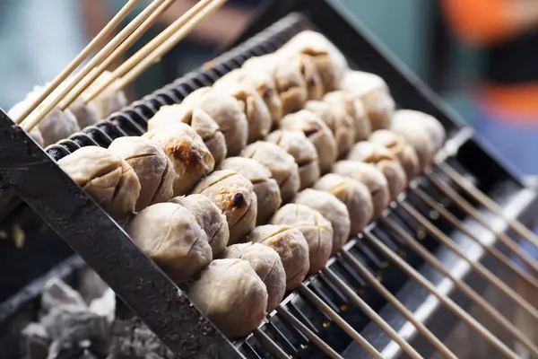 Thai meat ball with bamboo stick on the stove — Stock Photo, Image
