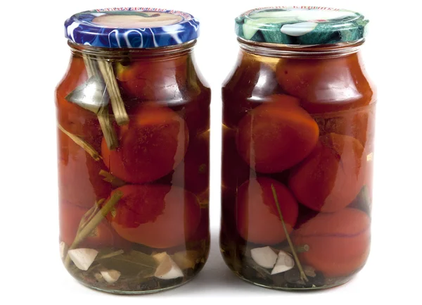 Preserved tomatoes in jars — Stock Photo, Image