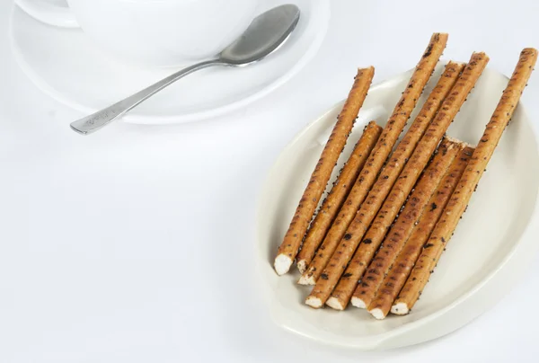 Long thin biscuit sticks and tea — Stock Photo, Image