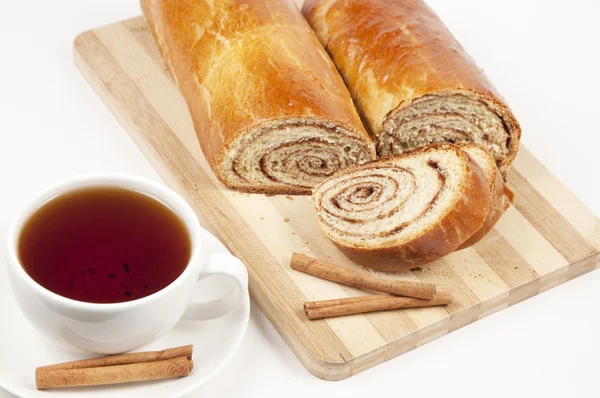 Cup of Tea and sweet rolls with cinnamon — Stock Photo, Image