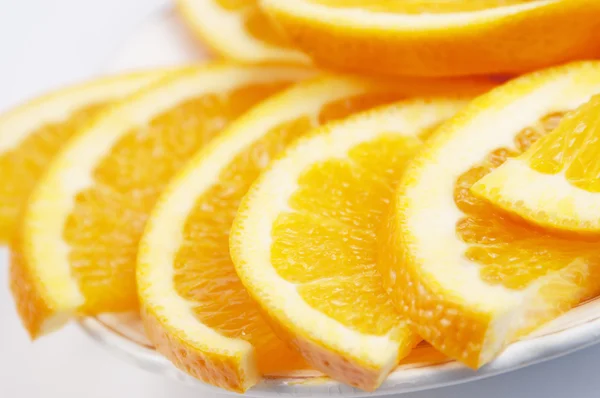 Orange cuts on a plate Stock Image