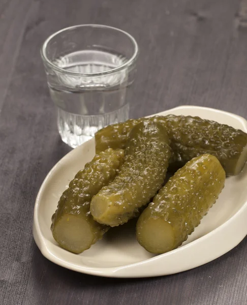 Salted cucumbers and vodka — Stock Photo, Image