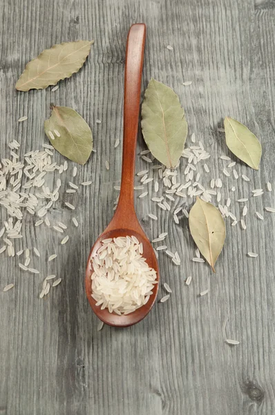 Rice in a wooden spoon — Stock Photo, Image